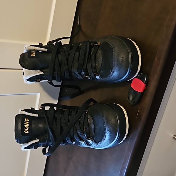 Olang ankle black boots with white trim and black polka dots. - Picture 2 of 5